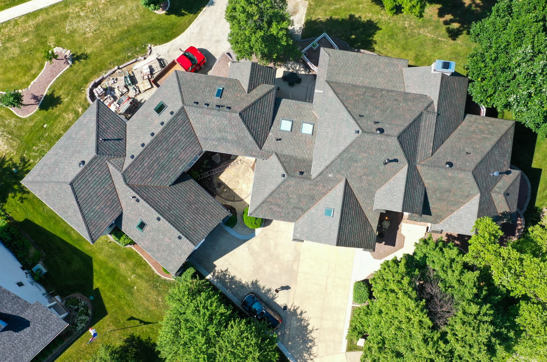 Aerial view of a large home finished in Brava composite slate roofing