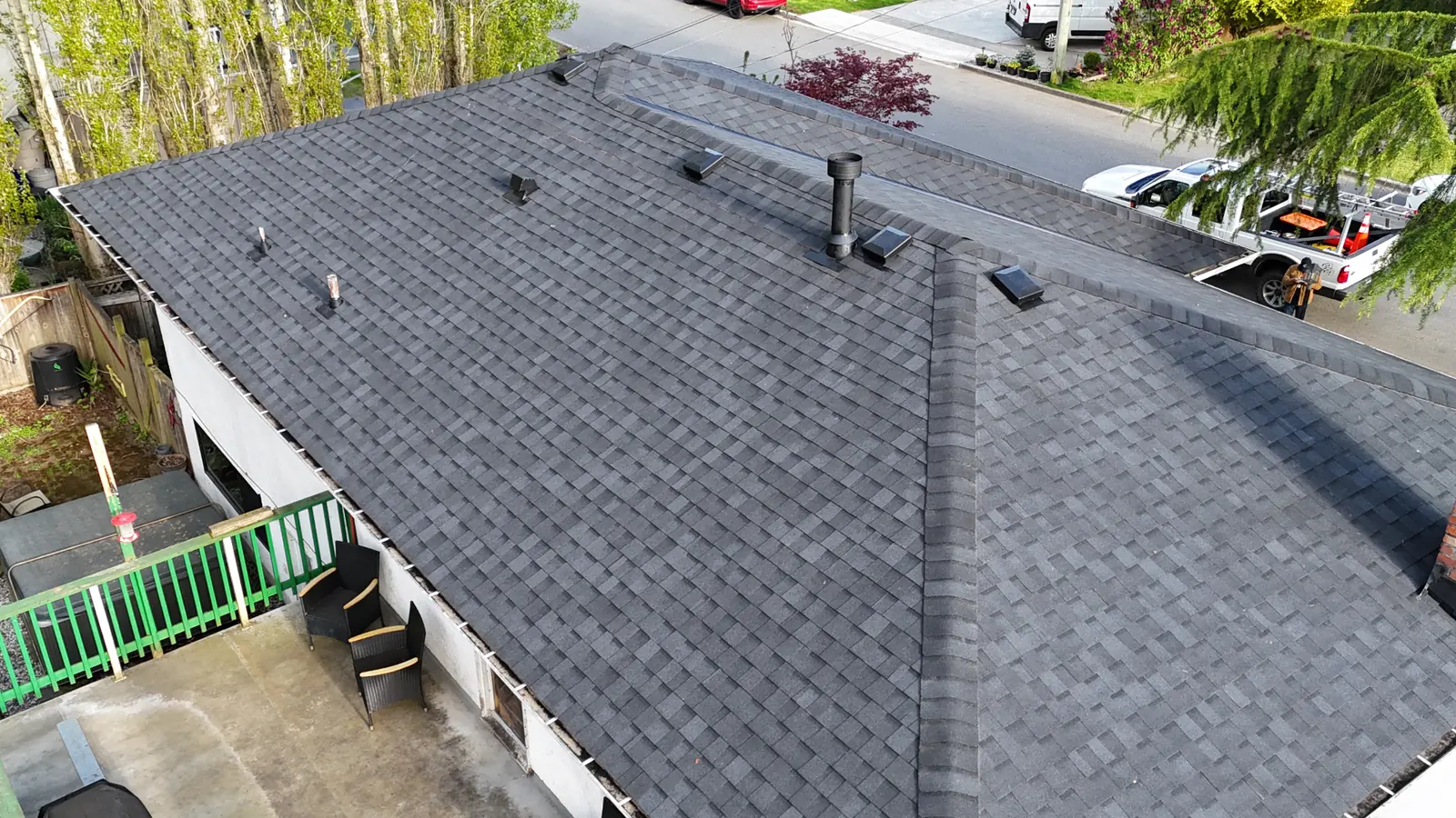 Aerial view of a completed residential asphalt shingle roof
